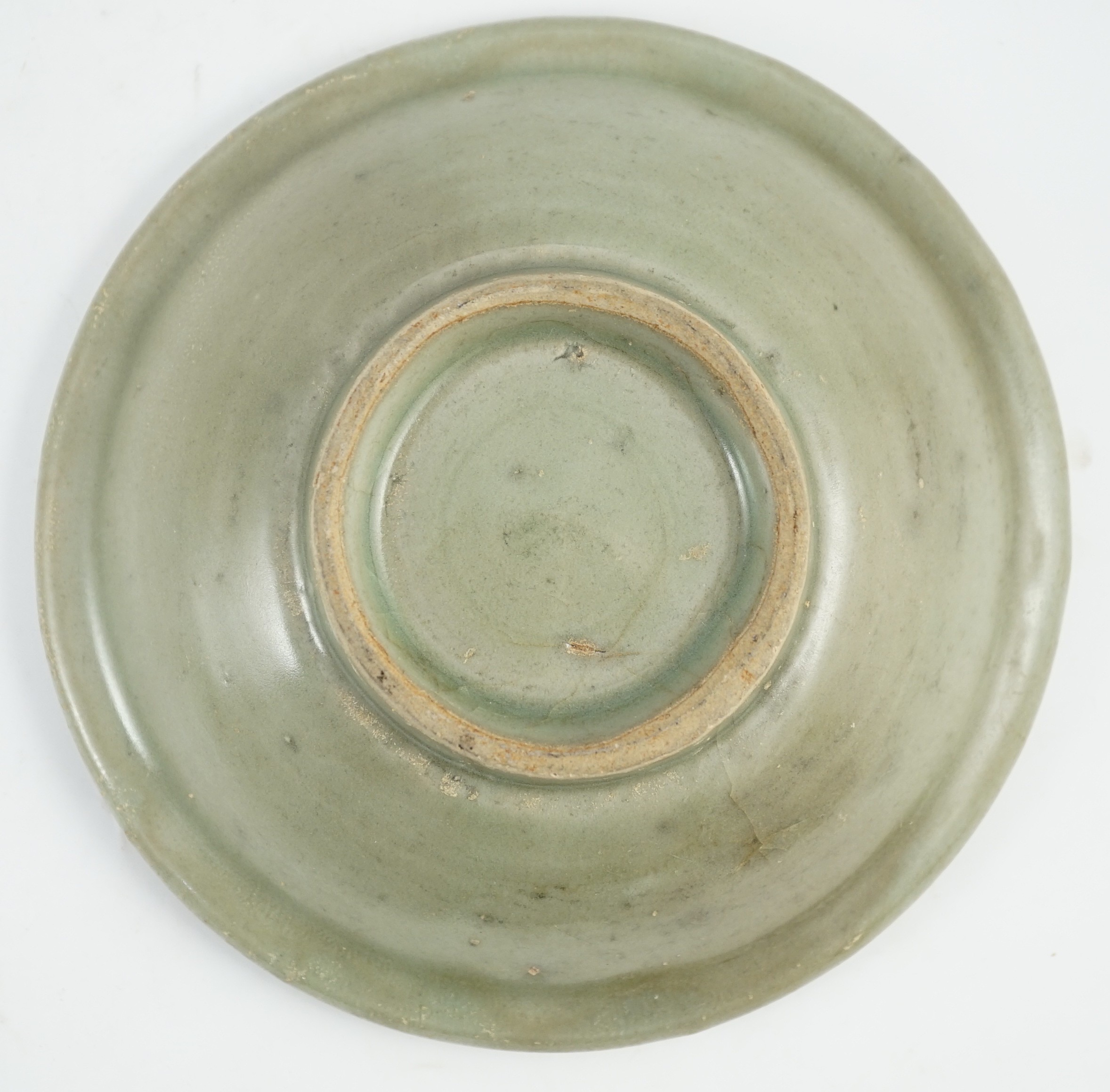 A small Chinese Ming Longquan celadon dish, 15th/16th century, 16.2cm diameter, some faults